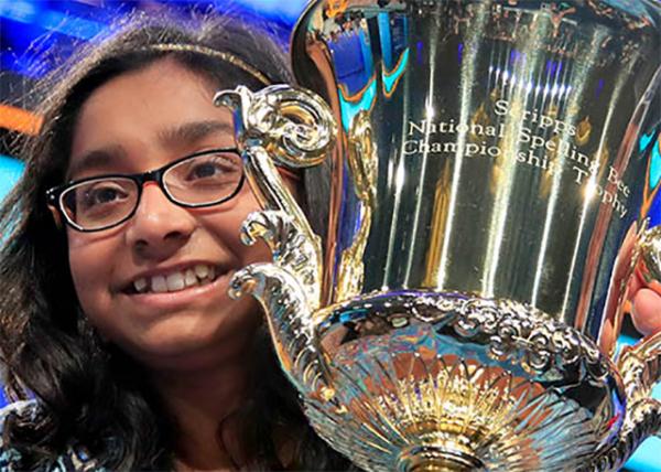 Ananya Vinay, a sixth-grader from Fresno, California, hoists the Scripps National Spelling Bee trophy after her win. Vinay’s favorite word is spizzerinctum, which means "the will to succeed."