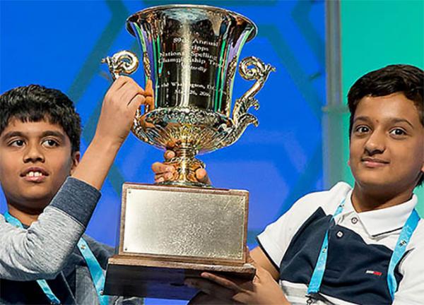 Nihar Janga (left) and Jairam Hathwar hoist the Scripps National Spelling Bee trophy after being named co-champions on May 26 in National Harbor, Maryland.