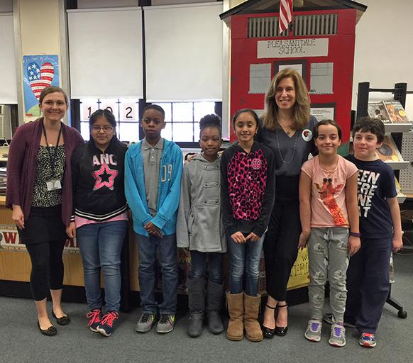 Students and Library Media Specialist at Kelly Elementary School (West Orange, NJ) pose with Lauren Tarshis.