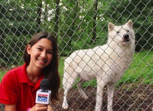 Ava with Atka, an Artic Gray wolf at the Wolf Conservation Center in South Salem, NY.