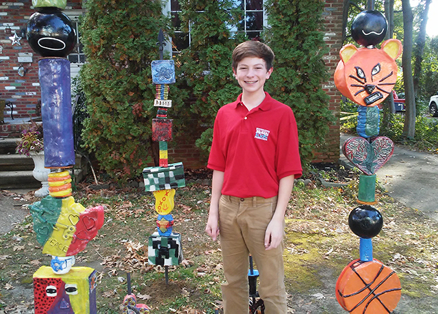 The clay totem poles in front of Say It With Clay in Collingswood NJ.