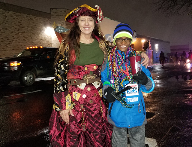 Owen with Helen Phares, captain of a Mardi Gras krewe and coordinator of the Children’s Parade in Bossier City 