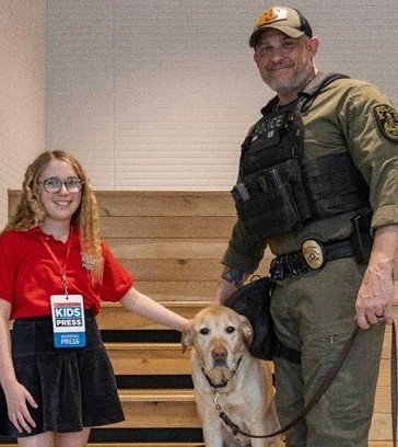 Coco with K-9 handler and trainer Officer Derek P. and K-9 Beethoven