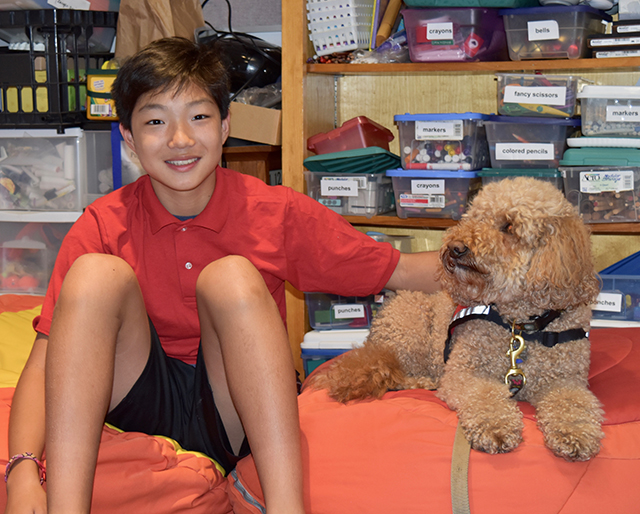 Stone with Molly, an Australian labradoodle