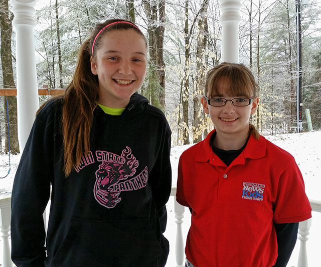 Kid Reporter Kaitlin Clark and Delaney Pickering in her basketball team sweatshirt.