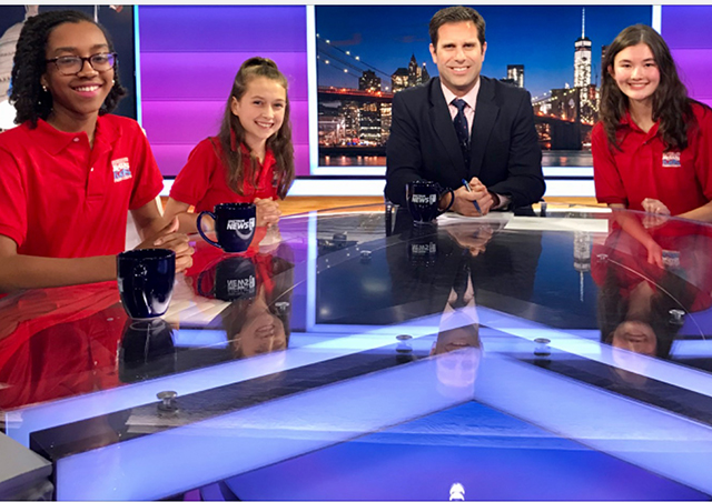 Left to right: Kid Reporters Christina Lilavois, Amelia Poor, and Charlotte Fay discuss the New York City mayoral race with NY1 news anchor Josh Robin.