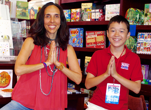 Susan Verde and Max strike a yoga pose