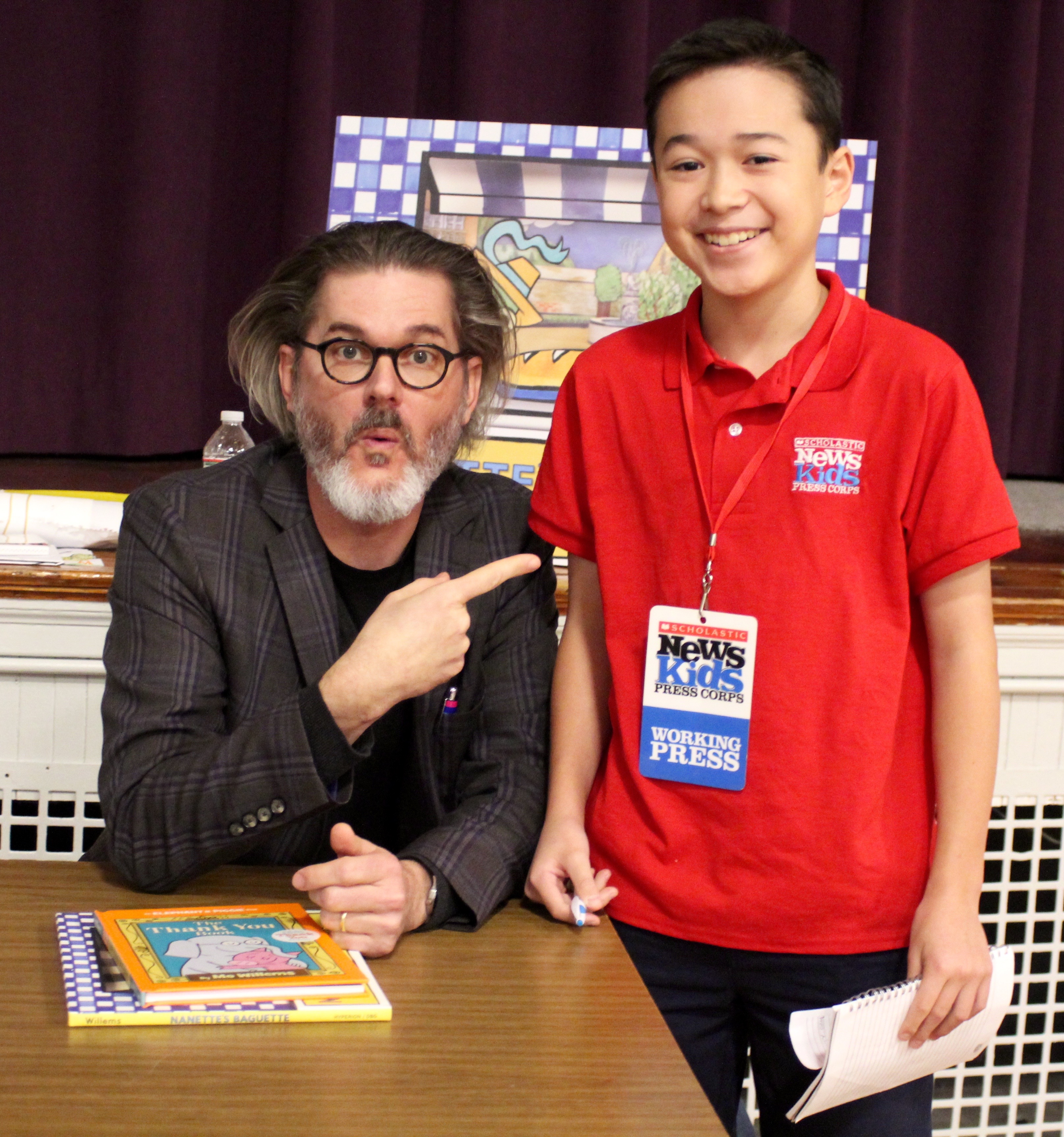 Max wows children's book author and illustrator Mo Willems at the Mother Brook Arts and Community Center in Dedham, Massachusetts.