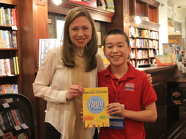 Max and Chelsea Clinton holding "It's Your World: Get Informed, Get Inspired, & Get Going" at R.J. Julia Booksellers in Madison, CT