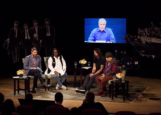 Left to right: Scholastic Vice President Billy DiMichele, Whoopi Goldberg, Dave Grohl, and Stevie Van Zandt talk about the influence of the Beatles at a Scholastic event celebrating the British rock group's influence. Larry Kane shares his thoughts via satellite.