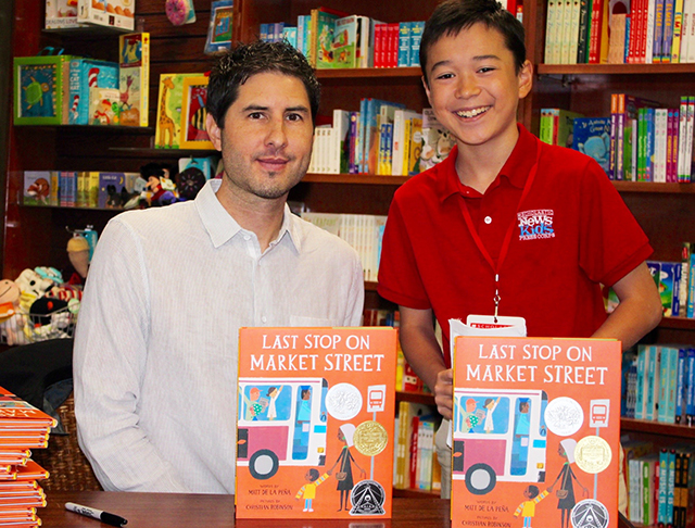 Max and children's author Matt de la Pena at Wellesley Books in Wellesley, Massachusetts