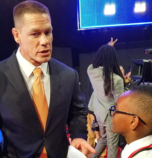 Owen interviewing John Cena on the red carpet