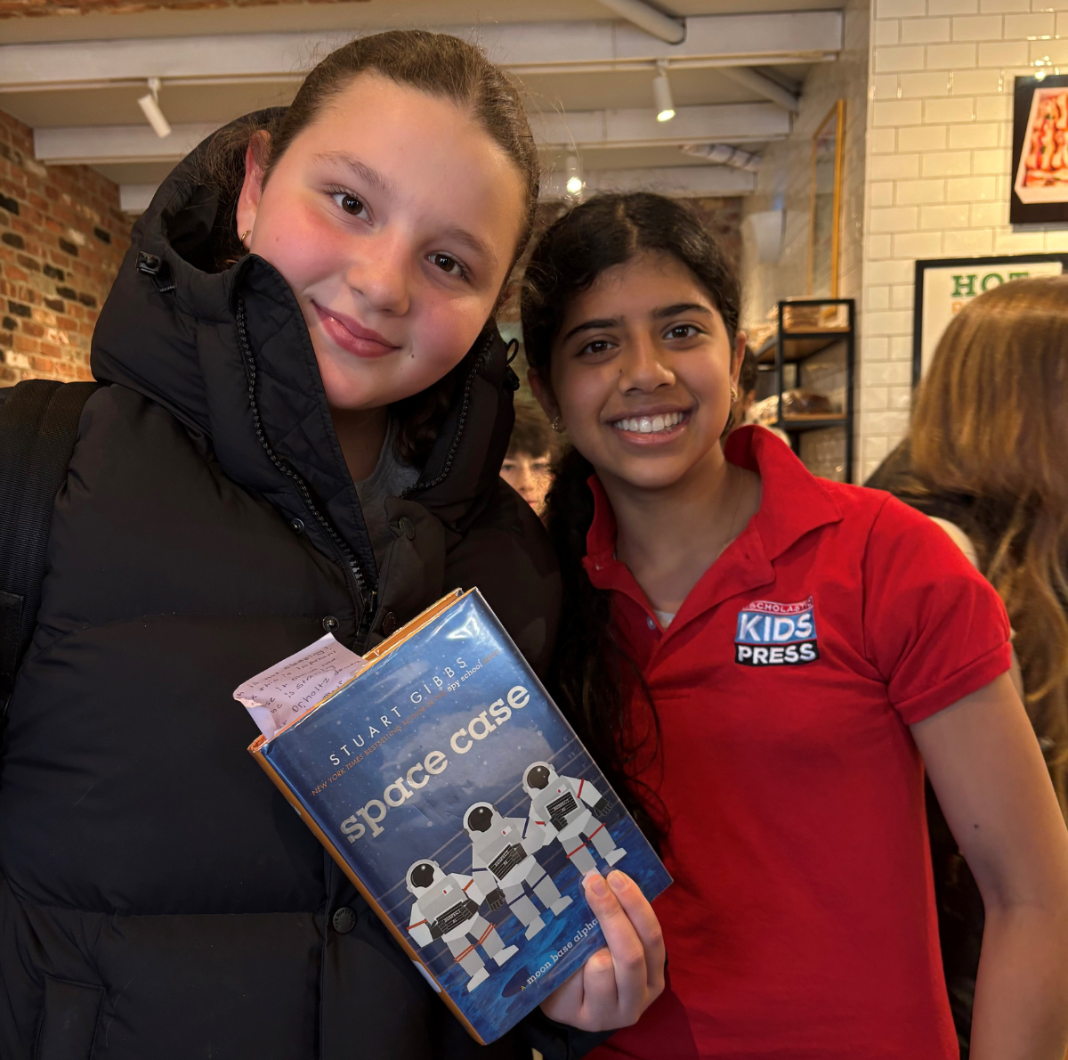 Scholastic Kid Reporter Leyla Saldanha and Rosie Bondy, age 13, with a print book, the preference for many students when reading. Scholastic Kid Reporter Leyla Saldanha and Rosie Bondy, age 13, with a print book, the preference for many students when reading.