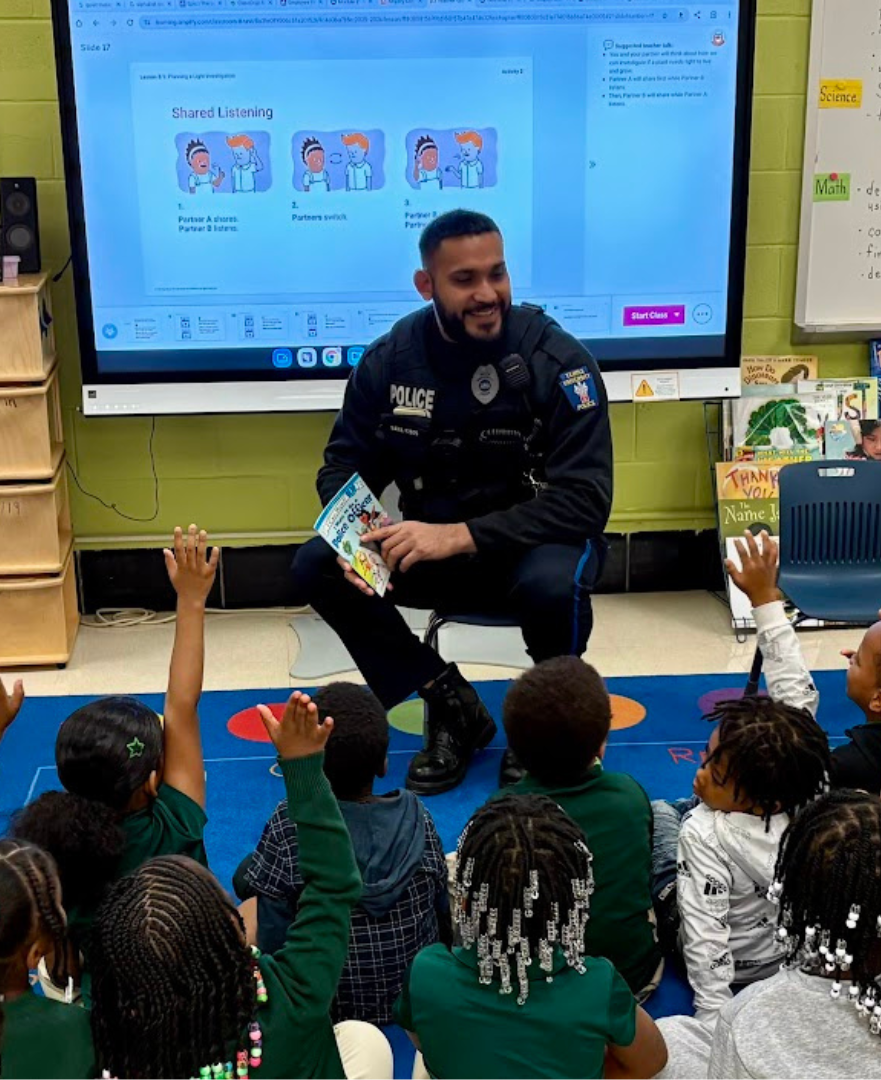 Temple University Police Officer Arashdeep Bawa visits a local elementary school to read to students. Photo credit: Matt Perillo. 