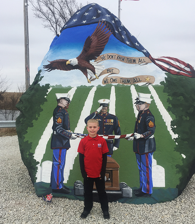 Brandon in front of the original Freedom Rock.