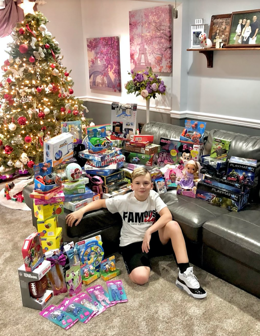 Giving Back Through Toys For Tots Kid
