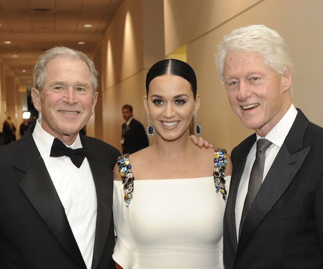 Former Presidents George W. Bush and Bill Clinton with Katy Perry at the Starkey awards gala. Photo by Greg Jansen.