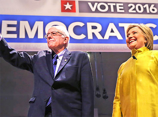 Vermont Senator Bernie Sanders and Former Secretary of State Hillary Clinton greet the crowd at the University of Wisconsin in Milwaukee. Sanders and Clinton are vying for the Democratic nomination for president.