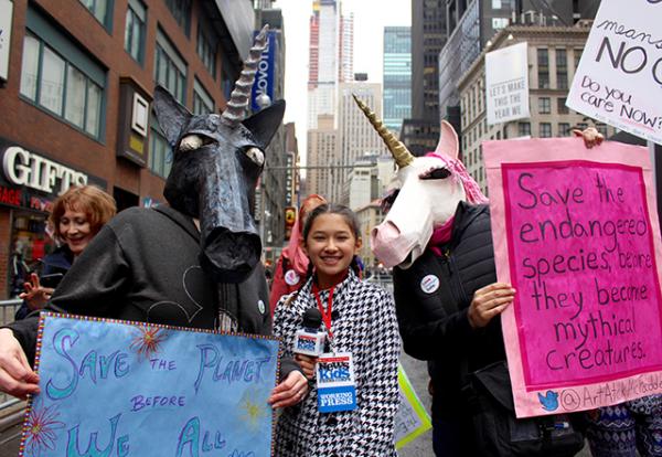 Beth McFadden an artist from Quakertown, Pennsylvania, made unicorn masks and carried signs that read: “Save the endangered species before they become mythical creatures.”