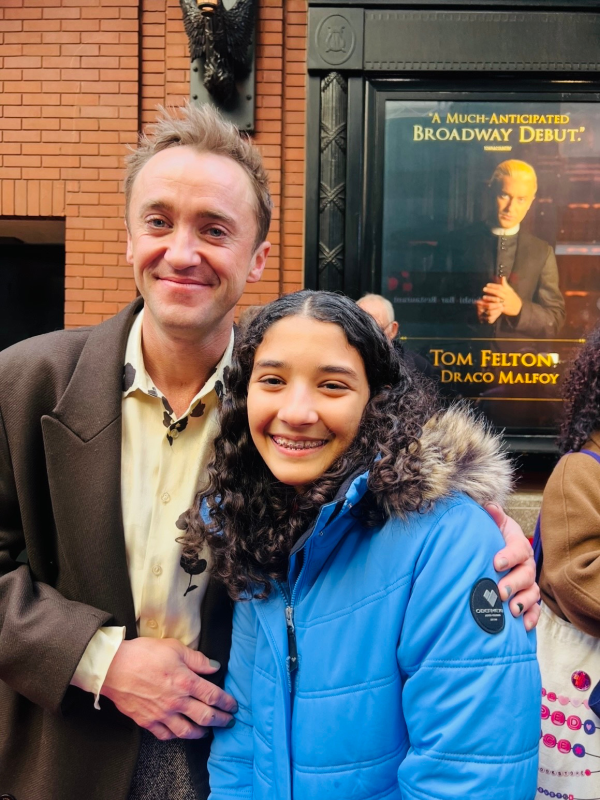 Kid Reporter Sara Adibi with actor Tom Felton 