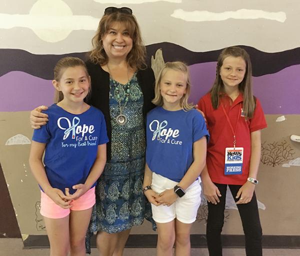 Annika with Saylor Archard, Ella Norman, and Cynthia Calvillo-Murray, their fourth-grade teacher