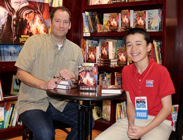 Max with children's book author Brandon Mull at Blue Bunny Books in Dedham, Massachusetts