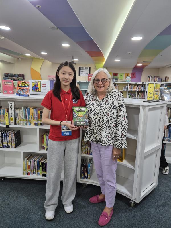 Kid Reporter Josephine Lee pictured with Ms. Sewall. Elementary School Librarian at Chadwick International School Kid Reporter Josephine Lee pictured with Ms. Sewall. Elementary School Librarian at Chadwick International School