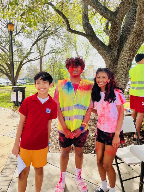 Volunteers Aayush Khadse (middle) and Aanya Gautam (right) help register participants for the Holi festival. Volunteers Aayush Khadse (middle) and Aanya Gautam (right) help register participants for the Holi festival.