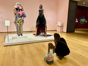 Brickner sharing her love of art with her daughter at the Hood Museum in New Hampshire looking at sculptures by Jeffrey Gibson and Nick Cave. Brickner sharing her love of art with her daughter at the Hood Museum in New Hampshire looking at sculptures by Jeffrey Gibson and Nick Cave.