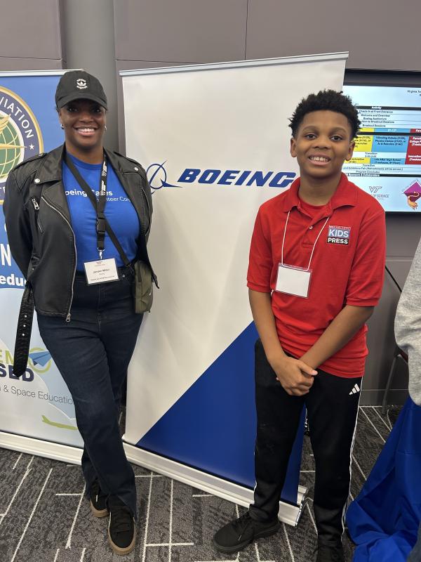 Xander poses with Boeing's Jordon Miller Xander poses with Boeing's Jordon Miller