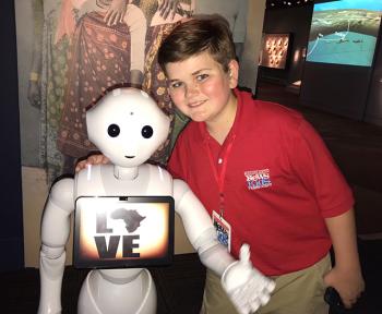 Nolan with Pepper the robot at the National Museum of African Art