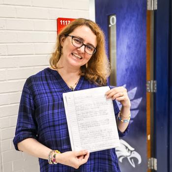 Author Tui Sutherland pictured with a drawing of a dragon