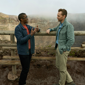 Professor Chris Jackson and Tom Hiddleston discuss the events at Pompeii from atop Mt. Vesuvius (National Geographic/Paolo Verzone). 