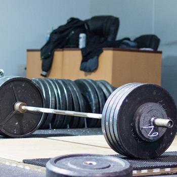 Loaded barbell (Photo by Lance Goyke)What does it take to be the best? Powerlifter Naomi Kutin found out.