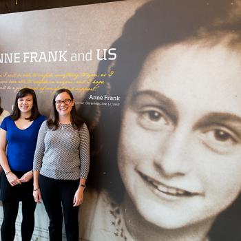 Charlotte (left) with Hannah Vaughn (center) and Beth Slepian near the entrance of the Anne Frank Center USA in New York City
