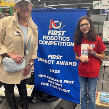 Aria with a staff member from the FIRST Robotics Competition