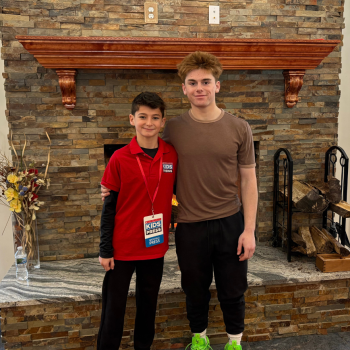Scholastic Kid Reporter Asher Freije with speed skater Quinn Derheimer. 