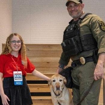 Coco with K-9 handler and trainer Officer Derek P. and K-9 Beethoven