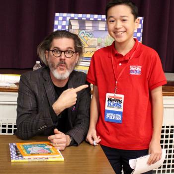 Max wows children's book author and illustrator Mo Willems at the Mother Brook Arts and Community Center in Dedham, Massachusetts.