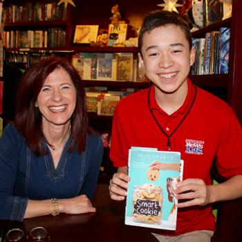Max with children's author Elly Swartz at her book launch for Smart Cookie at Blue Bunny Books in Dedham, Massachusetts