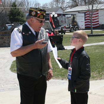 Brandon interviewing the event organizer, Jerry Christensen about why he brought the memorial to Britt, IA.