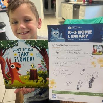 A Tennessee student with his K–3 Home Library pack