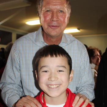 Ohio Governor John Kasich with Maxwell Surprenant at a “town hall” event in Goffstown, New Hampshire.