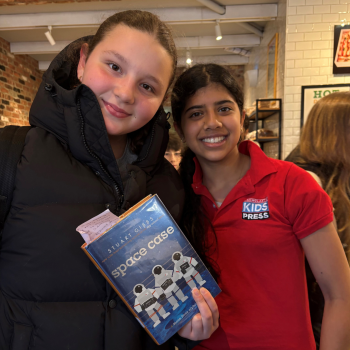 Scholastic Kid Reporter Leyla Saldanha and Rosie Bondy, age 13, with a print book, the preference for many students when reading. 