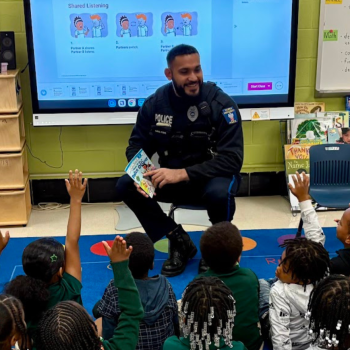 Temple University Police Officer Arashdeep Bawa visits a local elementary school to read to students. Photo credit: Matt Perillo. 