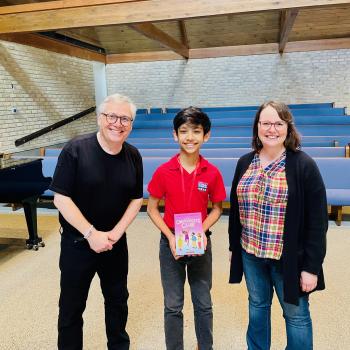 Kush with Raina, Scott and their book, The Cartoonists Club