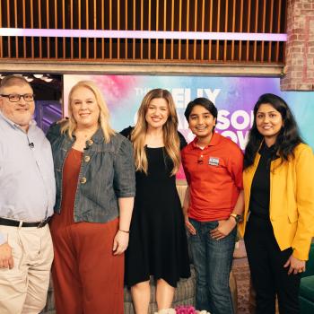 Syd's Book Shack & Boutique co-owners Paul DeJohn and Meredith Daggett, Kelly Clarkson, and Scholastic Kid Reporter Arjun Atluri and Mounika Atluri