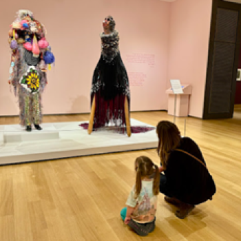 Brickner sharing her love of art with her daughter at the Hood Museum in New Hampshire looking at sculptures by Jeffrey Gibson and Nick Cave. 