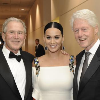 Former Presidents George W. Bush and Bill Clinton with Katy Perry at the Starkey awards gala. Photo by Greg Jansen.