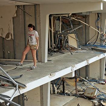 A girl walks through her ruined apartment building in Biloxi, Mississippi. Hurricane Katrina caused extensive damage in the Southeast in August 2005.